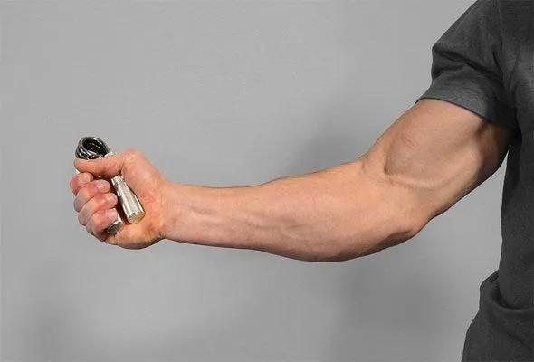Muscle Man use hand grips for building crushing grip